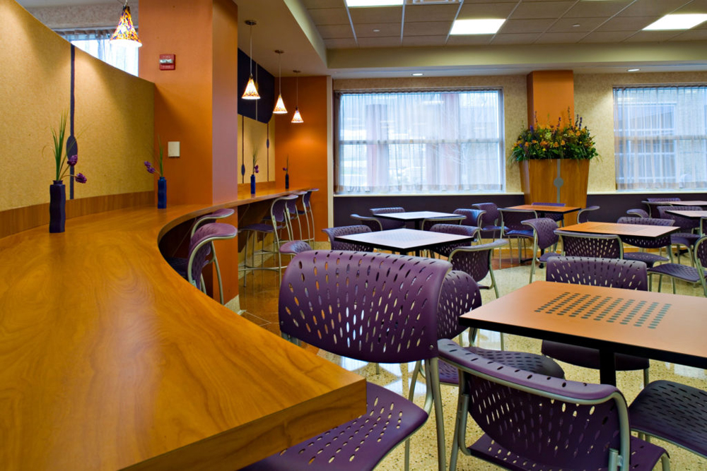 hospital cafeteria seating, tables and wall screens